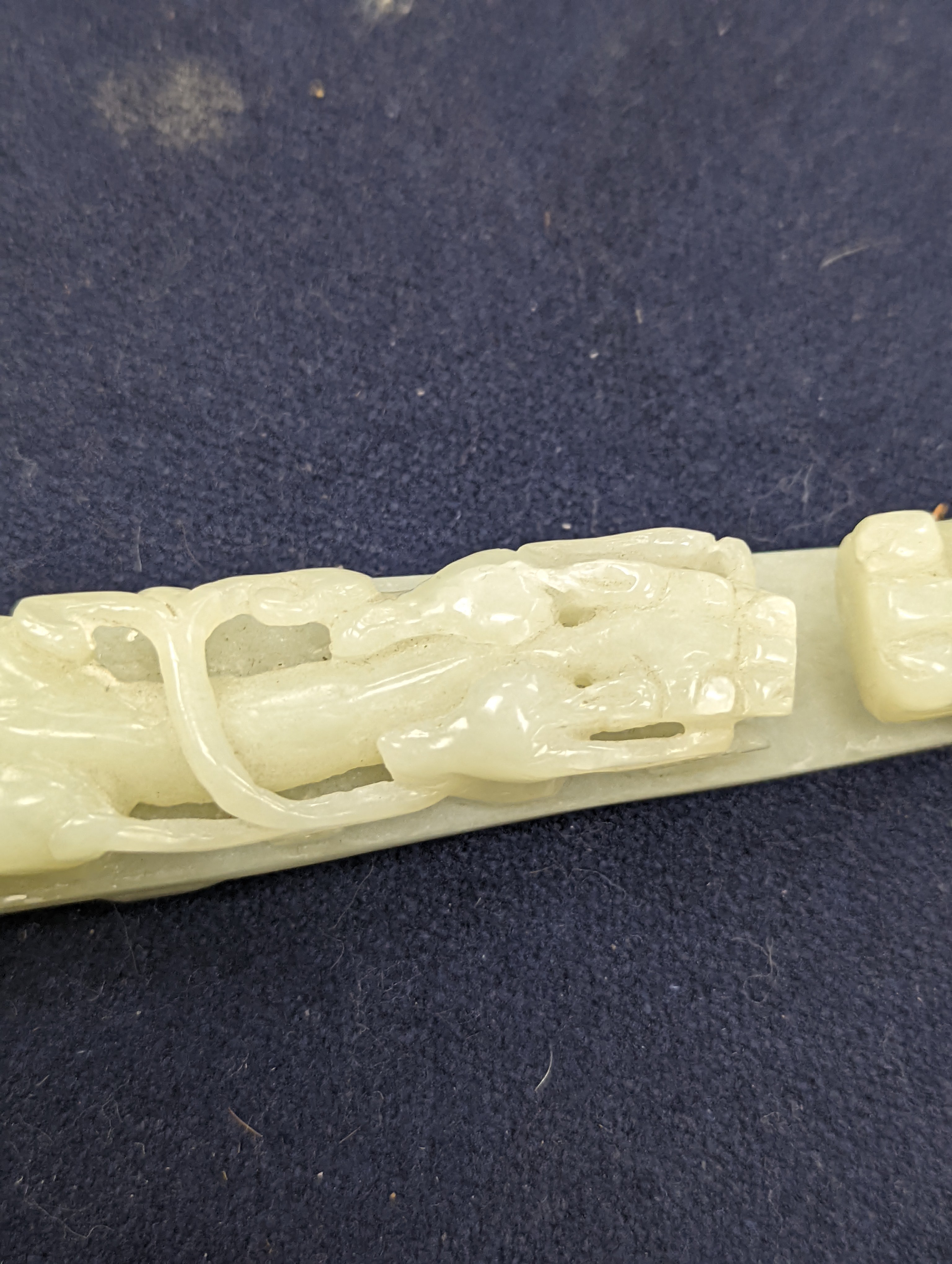 A Chinese jade belt hook, 12.5cm an archer's ring and figure, a stone cup and a glass snuff bottle